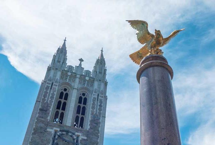 Photo looking up at the eagle and Gasson Hall